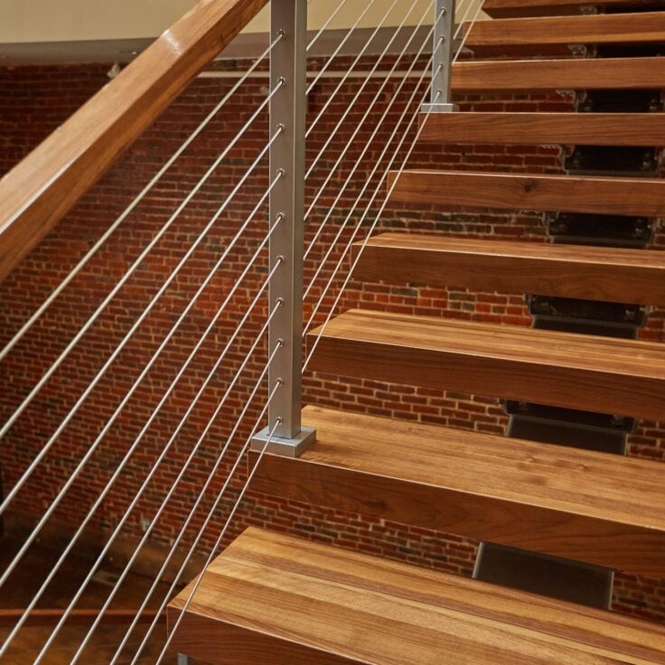 Cable railing on floating stairs closeup