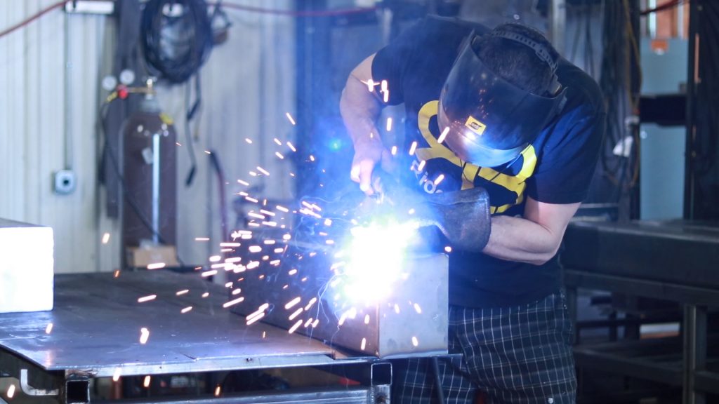 Welder fusing metal stair together