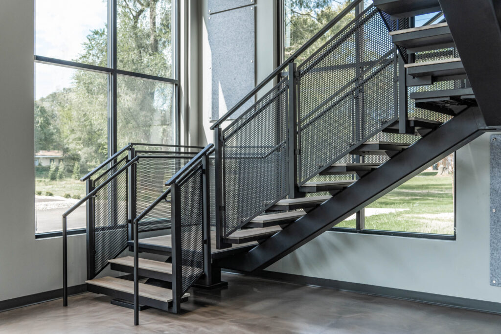 Floating Stairs made from Porcelain Treads and Perforated Railing Panels